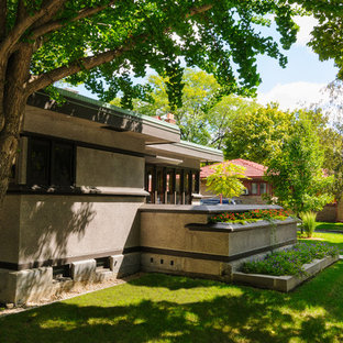 Inspiration for a small traditional front yard shaded garden for summer in Milwaukee with a container garden and concrete pavers.