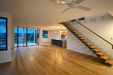 Mid-sized minimalist open concept light wood floor living room photo in Brisbane with no fireplace and no tv