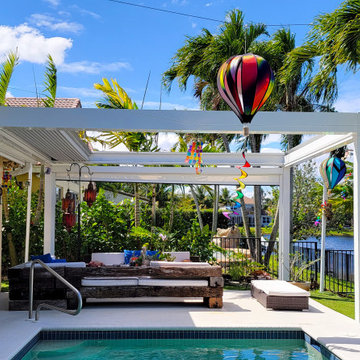 Retractable Pergola with Motorized Screens on Poolside Patio