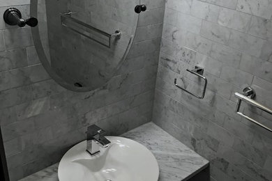 Design ideas for a small contemporary 3/4 bathroom in Other with open cabinets, a one-piece toilet, gray tile, marble, marble floors, a vessel sink, marble benchtops and grey floor.