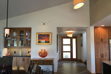 Inspiration for a mid-sized eclectic porcelain tile kitchen/dining room combo remodel in Denver with a standard fireplace
