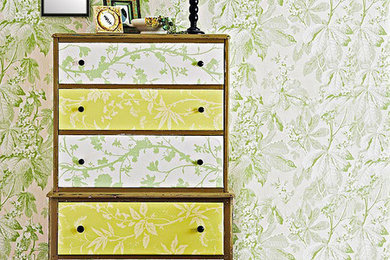 Example of a cottage chic guest dark wood floor and brown floor bedroom design in Other with green walls
