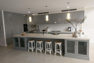 This is an example of a contemporary kitchen in Other with with island.