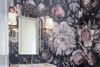 Example of a mid-sized classic marble floor and multicolored floor powder room design in Dallas with multicolored walls and a console sink