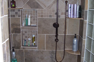 Inspiration for a mid-sized timeless master brown tile and porcelain tile porcelain tile doorless shower remodel in DC Metro
