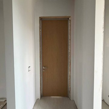 Hidden doors with laminated Walnut