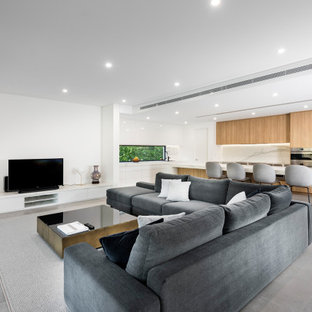 Expansive modern kitchen in Perth with an undermount sink, quartz benchtops, white splashback, engineered quartz splashback, stainless steel appliances, porcelain floors, with island, grey floor and white benchtop.