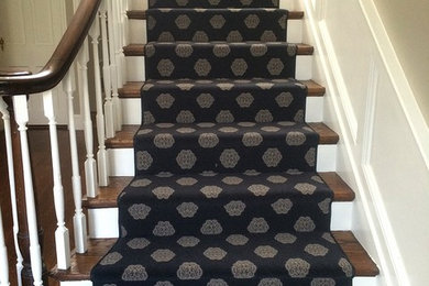 Staircase - mid-sized traditional carpeted l-shaped wood railing staircase idea in New York with carpeted risers