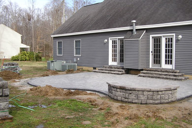 Patio - traditional backyard concrete paver patio idea in Other