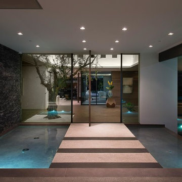 Benedict Canyon Beverly Hills luxury mansion modern front door entrance ponds