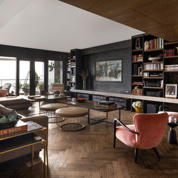 View of entire Living Room, showcasing pink 'Gio Ponti Armchairs'