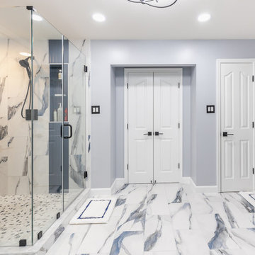 Bathroom remodeling in Columbia, MD with double vanity & marble bathtub