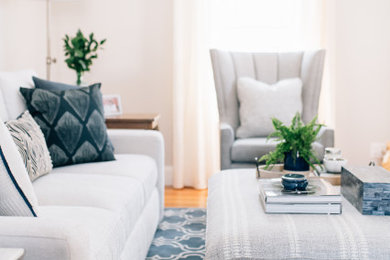 Example of a small transitional enclosed light wood floor living room design in Boston with a standard fireplace, a tile fireplace and a tv stand