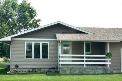 Large traditional beige one-story vinyl exterior home idea in Other with a shingle roof