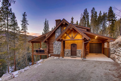 Inspiration for a mid-sized rustic brown three-story mixed siding exterior home remodel in Denver