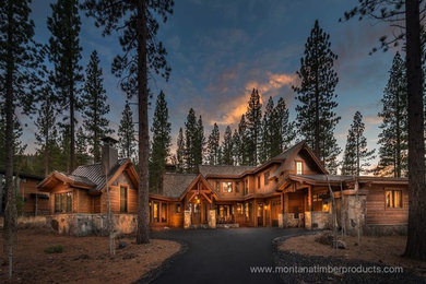 Large mountain style two-story wood house exterior photo in Sacramento