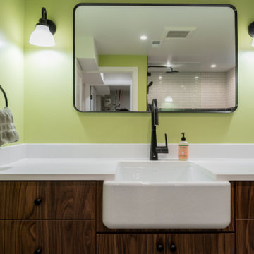 Black Matte Faucet and White Farmhouse Sink in Modern Basement Bath