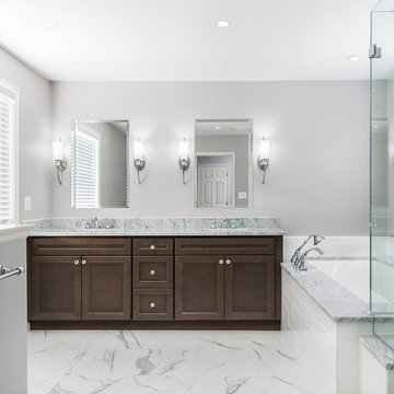 Simplistic Master Bathroom with a Frameless Shower