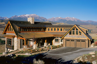 Large country three-storey brown house exterior in Denver with mixed siding, a gable roof and a mixed roof.