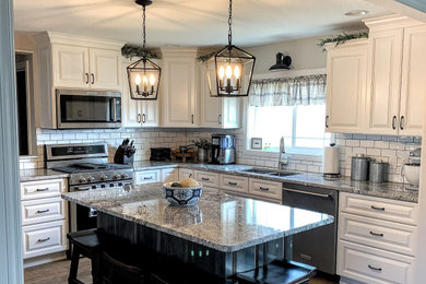 Inspiration for a mid-sized cottage l-shaped eat-in kitchen remodel in Other with an undermount sink, granite countertops, white backsplash, ceramic backsplash, stainless steel appliances, an island and gray countertops