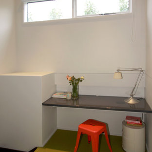 Design ideas for a modern study in Melbourne with white walls, carpet, no fireplace, a built-in desk and yellow floors.