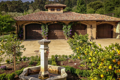 Inspiration for a large mediterranean detached four-car garage remodel in San Francisco