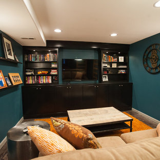 Design ideas for a small contemporary enclosed home cinema in Seattle with blue walls, concrete flooring, a wall mounted tv and brown floors.