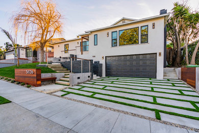 Large minimalist beige one-story house exterior photo in Los Angeles