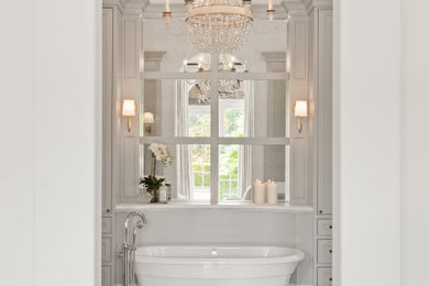 Bathroom - huge transitional master gray tile and marble tile marble floor, multicolored floor and double-sink bathroom idea in Orlando with recessed-panel cabinets, gray cabinets, white walls, a drop-in sink, marble countertops, a hinged shower door, white countertops, a niche and a built-in vanity