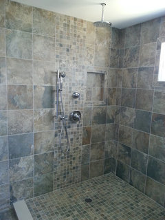 Same tiles on bathroom floor and shower wall