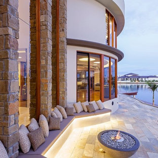 Design ideas for a contemporary patio in Sunshine Coast with a fire feature.