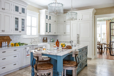 Inspiration for a mid-sized traditional separate kitchen in Jacksonville with a farmhouse sink, recessed-panel cabinets, white cabinets, subway tile splashback, panelled appliances, with island, green splashback, travertine floors and beige floor.