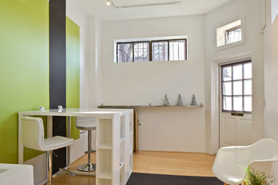 Example of a trendy home office design in Boston