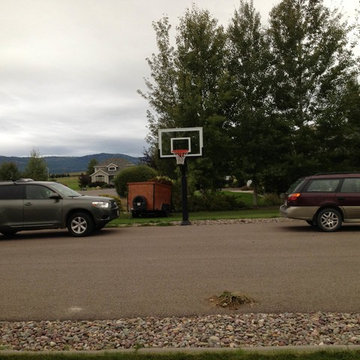 Aron E's Pro Dunk Silver Basketball System on a 60x30 in Lakeside, MT