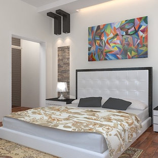 Ispirazione per una camera matrimoniale etnica di medie dimensioni con pareti bianche, pavimento in laminato e pavimento bianco