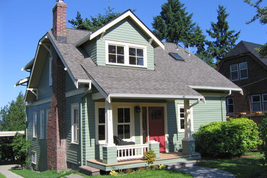 Small elegant two-story wood exterior home photo in Seattle