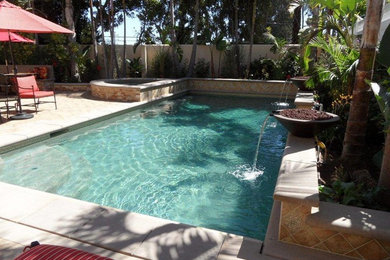 Inspiration for a large coastal backyard stone and rectangular lap hot tub remodel in Los Angeles