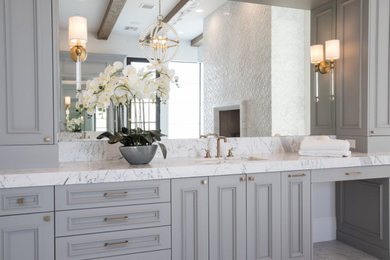 Bathroom - huge transitional master white tile and porcelain tile marble floor, white floor, double-sink and exposed beam bathroom idea in Phoenix with beaded inset cabinets, gray cabinets, a wall-mount toilet, white walls, an undermount sink, marble countertops, a hinged shower door, white countertops and a built-in vanity