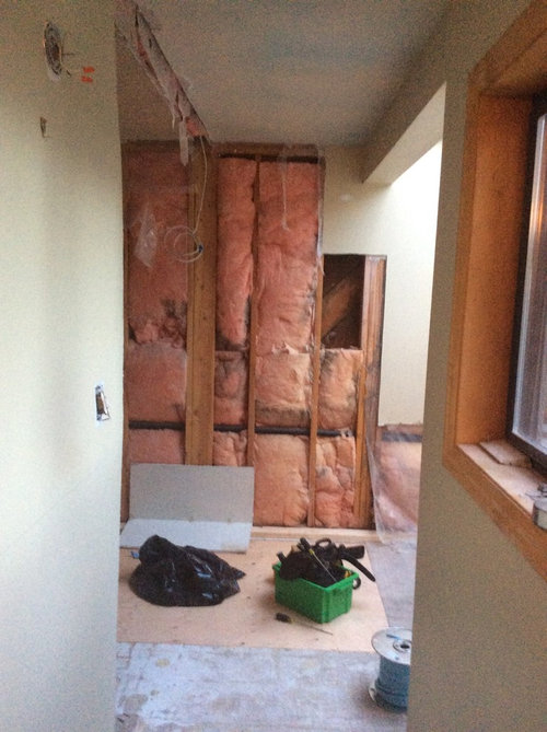 bathroom door swing into tub or out into bedroom hall?