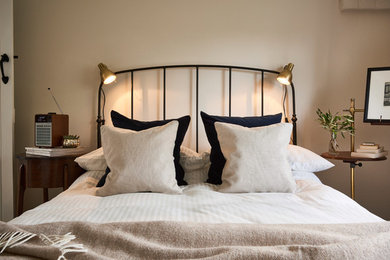 Inspiration for a small transitional guest bedroom in Hertfordshire with beige walls and no fireplace.