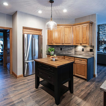 Reconfigured kitchen with new islands, countertops, backsplash