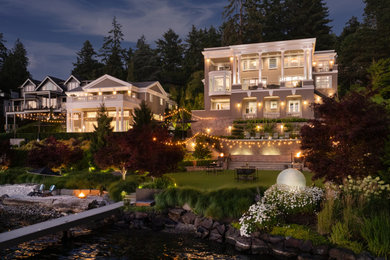 Huge contemporary beige three-story house exterior idea in Seattle