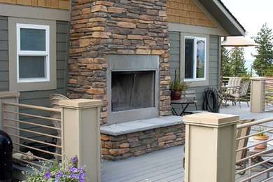 Inspiration for a traditional backyard deck in Seattle with a fire feature and no cover.