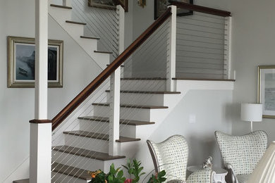 Inspiration for a mid-sized timeless wooden u-shaped staircase remodel in Providence with painted risers