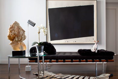 Example of a large minimalist dark wood floor and brown floor foyer design in New York with white walls