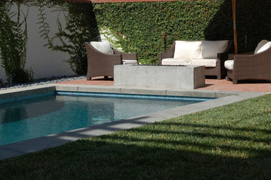 Inspiration for a mid-sized timeless backyard brick patio remodel in San Diego with a pergola