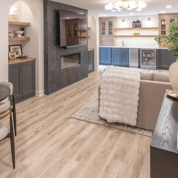 Warm & Inviting Basement Retreat with Custom Bar + Entertainment Center