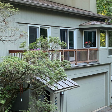 New garage door porch roof and open balcony railing