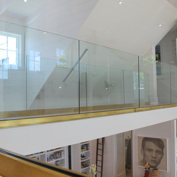Glass Balustrade with Aluminum Base Rail Finished with Satin Brass Cladding
