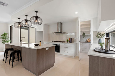 Inspiration for a large contemporary galley eat-in kitchen in Adelaide with a double-bowl sink, flat-panel cabinets, brown cabinets, quartz benchtops, beige splashback, ceramic splashback, black appliances, ceramic floors, with island, beige floor and white benchtop.